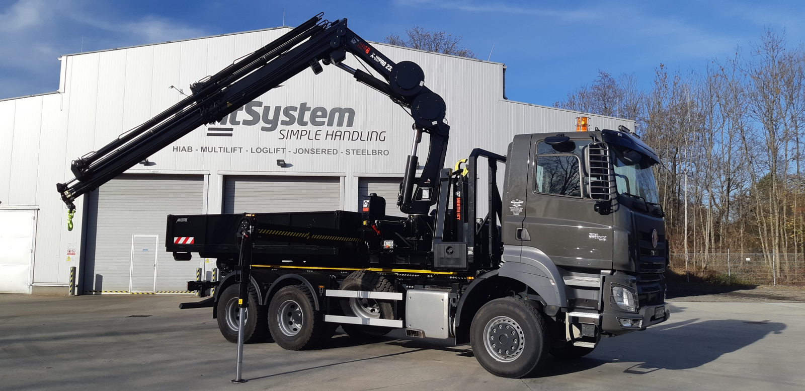 Hiab X-HiPro 232 on a removable flatrack platform for a company engaged in repairs, inspections and testing of electrical equipment